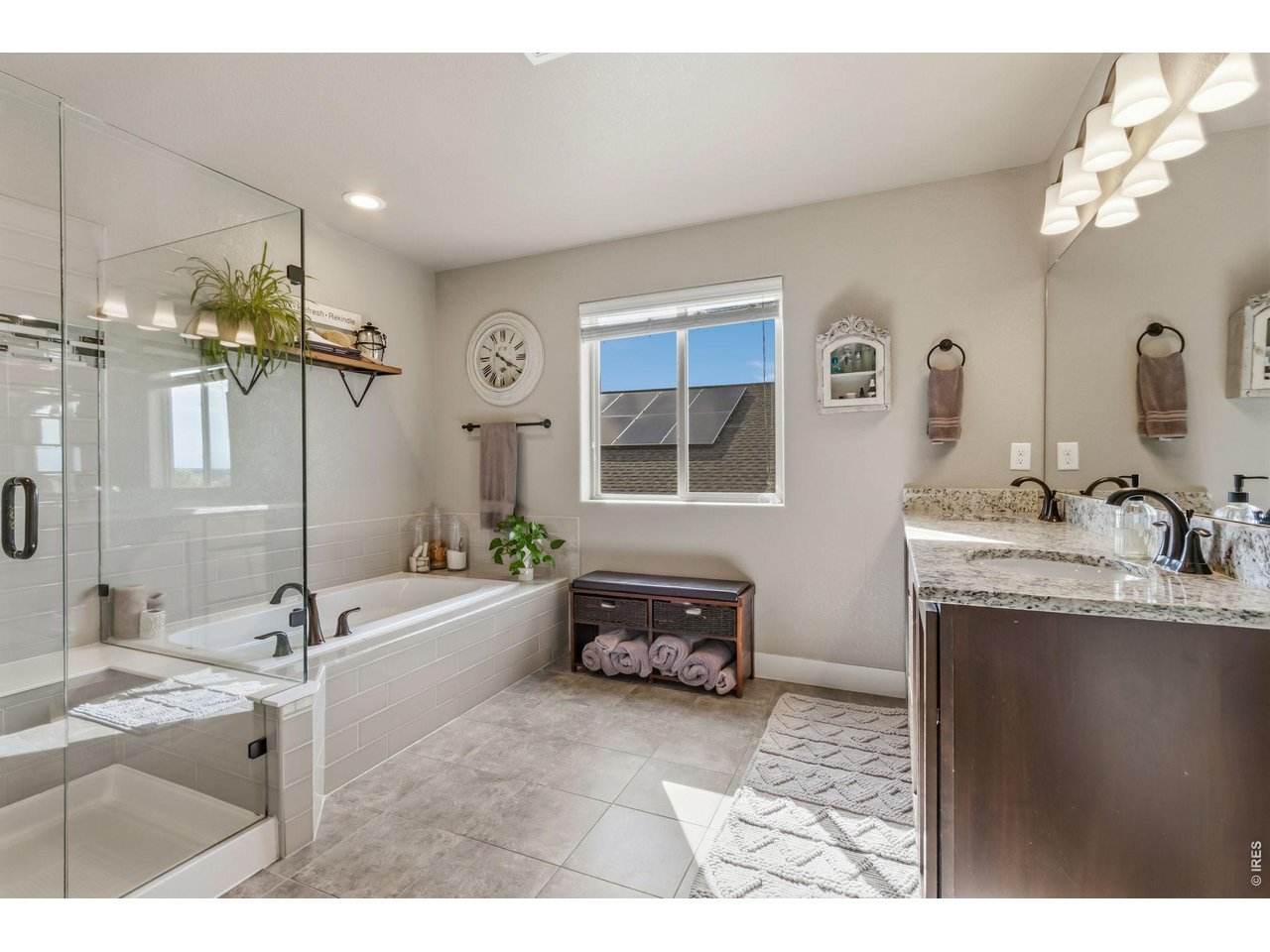 Property Photo 27 Primary bathroom with dual vanities and abundant cabinet storage.