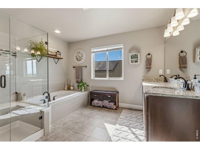Property Photo 27 Primary bathroom with dual vanities and abundant cabinet storage.
