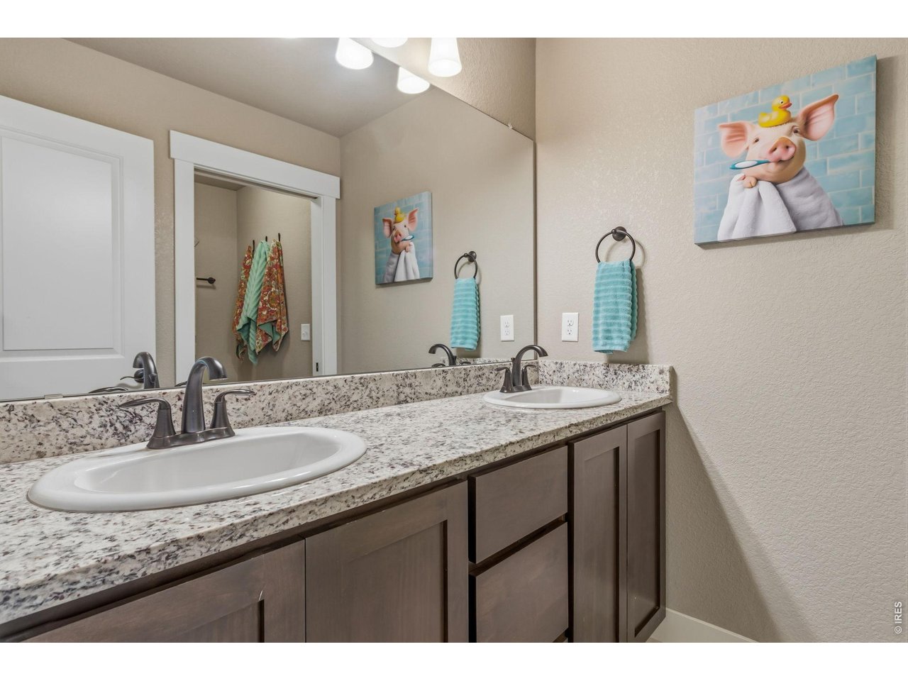 Property Photo 31 Shared upper bathroom with double sinks. Separate shower and toilet area provides added privacy for busy mornings.