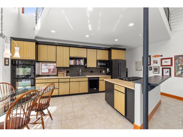 Property Photo 10 Custom Tharp Cabinetry with Solid Tigerwood!