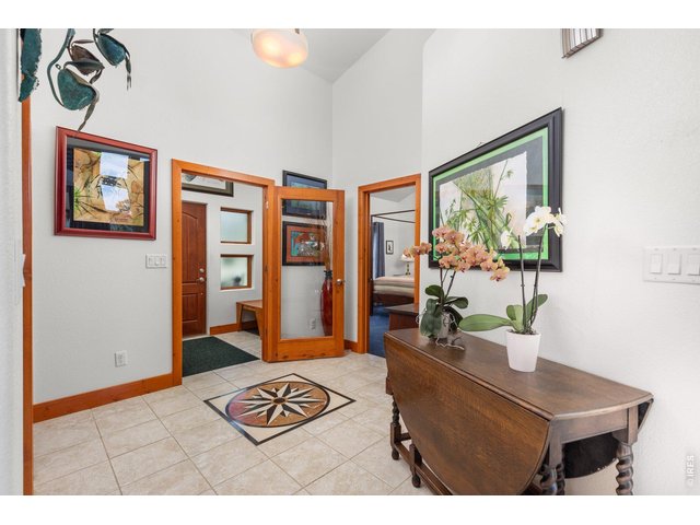 Property Photo 4 Airlock entry into home with custom tile inlay.