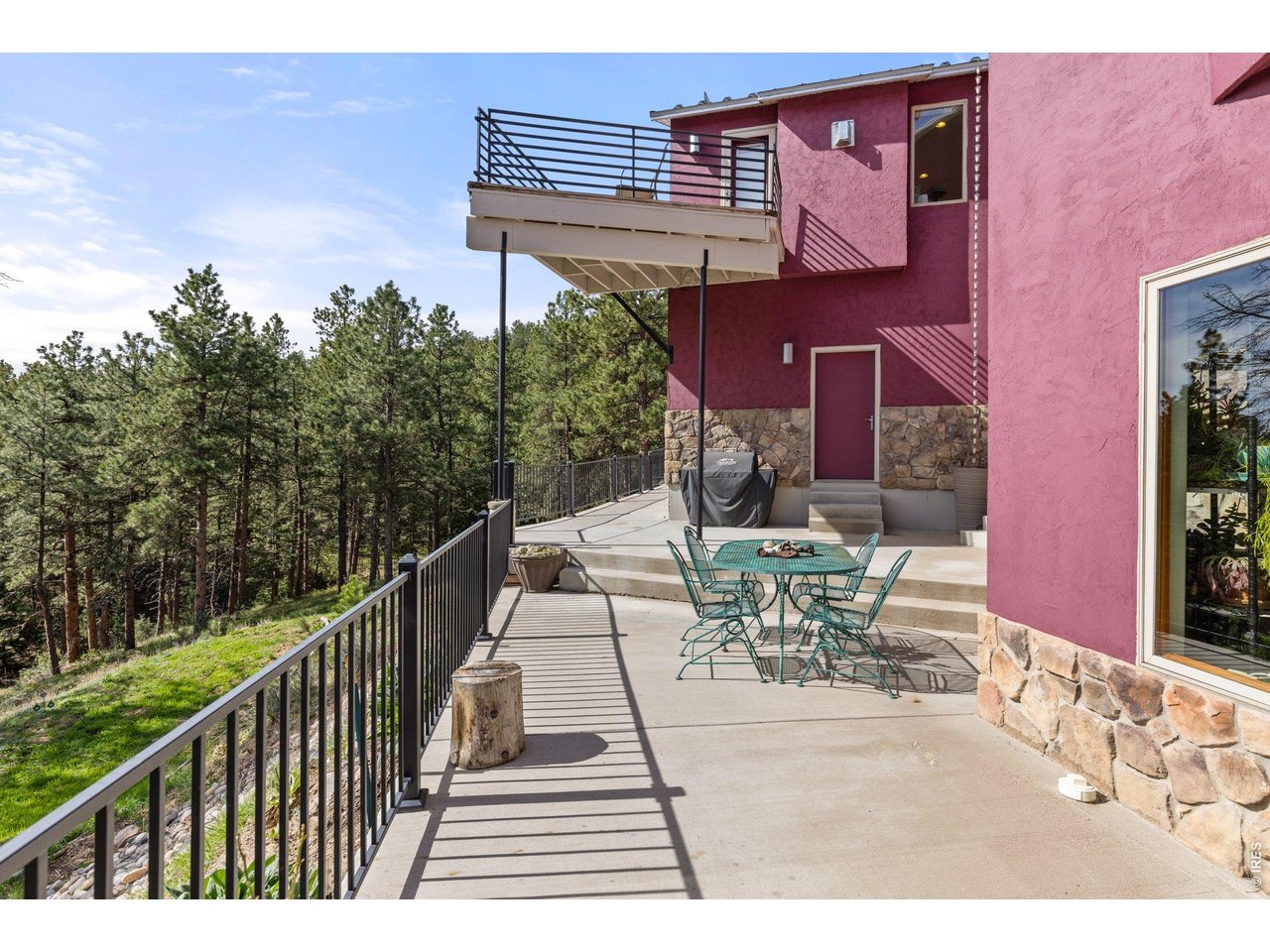 Back of Home with Patio and Balconies