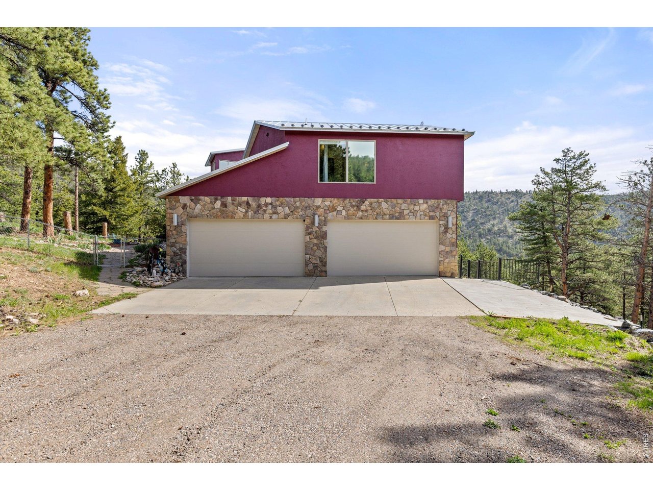 Large 4 Car Attached Garage with Additional Concrete Parking Pad
