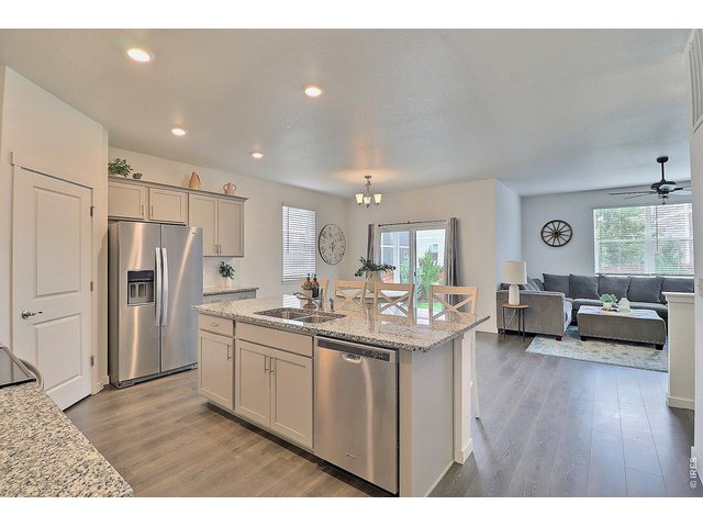 Property Photo 12 Kitchen open to living area, nice and bright