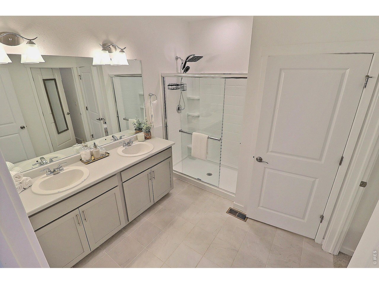Property Photo 27 Primary bath with double sinks and large walk-in closet 