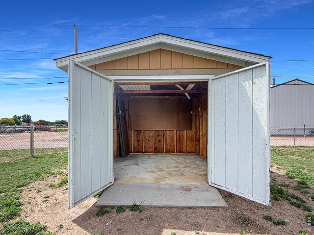 Property Photo 21 903 Storage shed with concrete slab