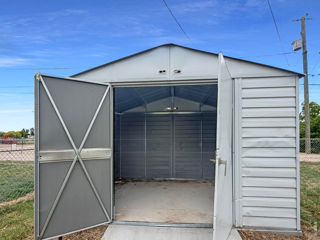 Property Photo 48 907 storage shed on concrete slab