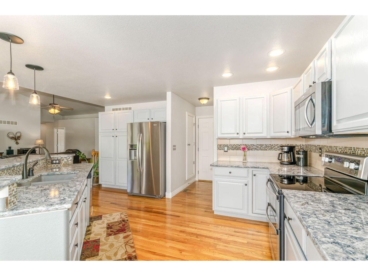 Updated pendant lighting and light cabinets brightens the space!