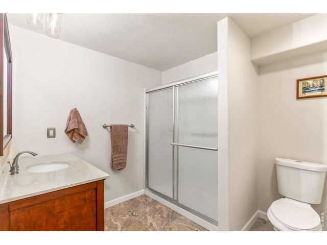 Property Photo 19 Large bathroom in basement with walk in shower