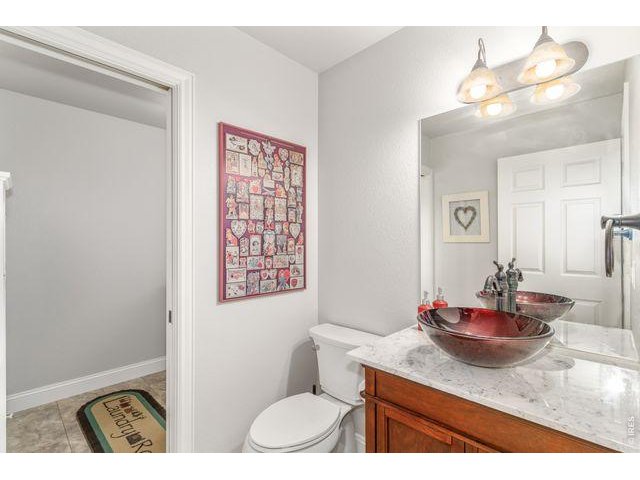 Property Photo 17 Powder room with bowl sink of laundry, garage, and kitchen.