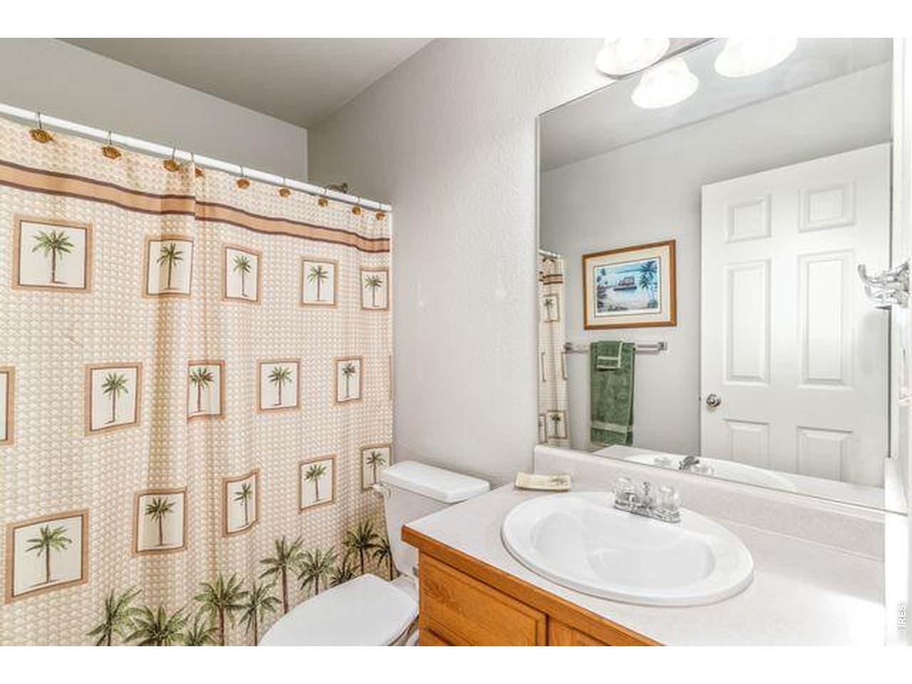 Full bath sits next to the 2nd and 3rd bedrooms on the main floor