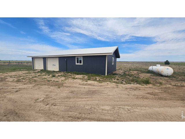 Property Photo 41 Oversized garage with workshop area