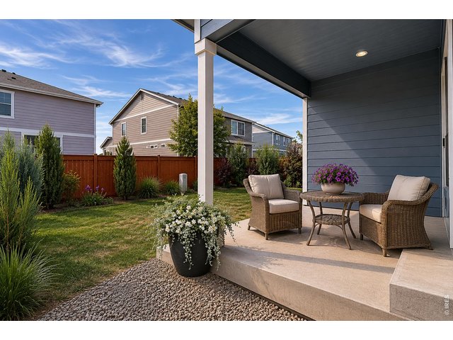 Property Photo 40 Covered back patio and fenced yard-photo virtually enhanced