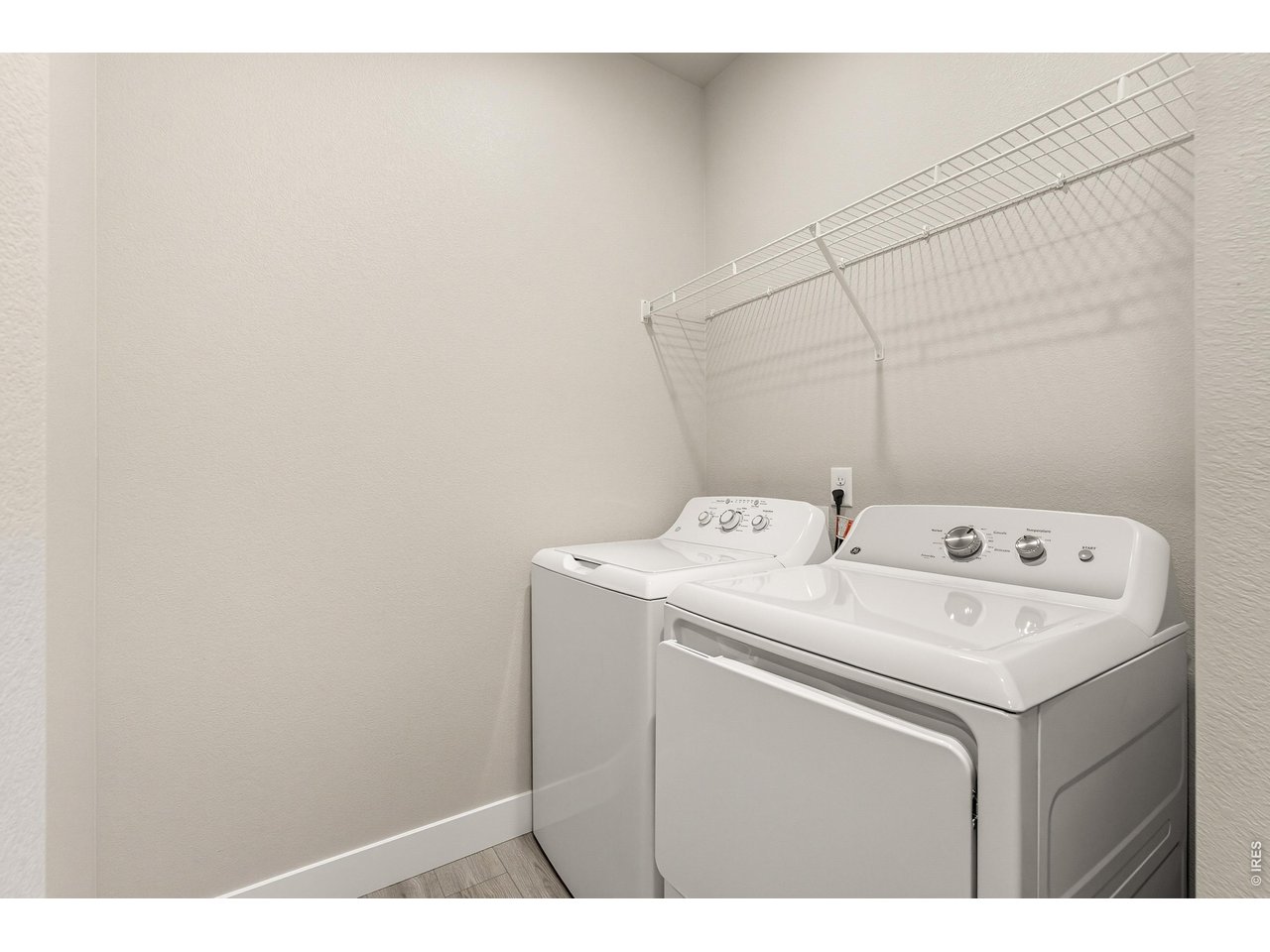 Property Photo 14 Laundry room with washer, dryer and built in shelving. 