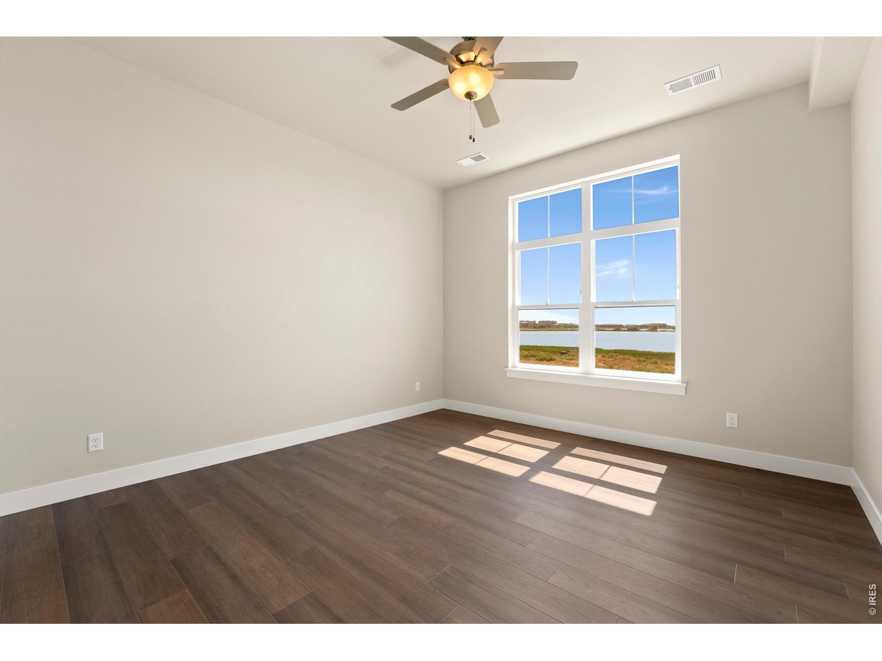 Property Photo 10 Primary bedroom with ceiling fan included