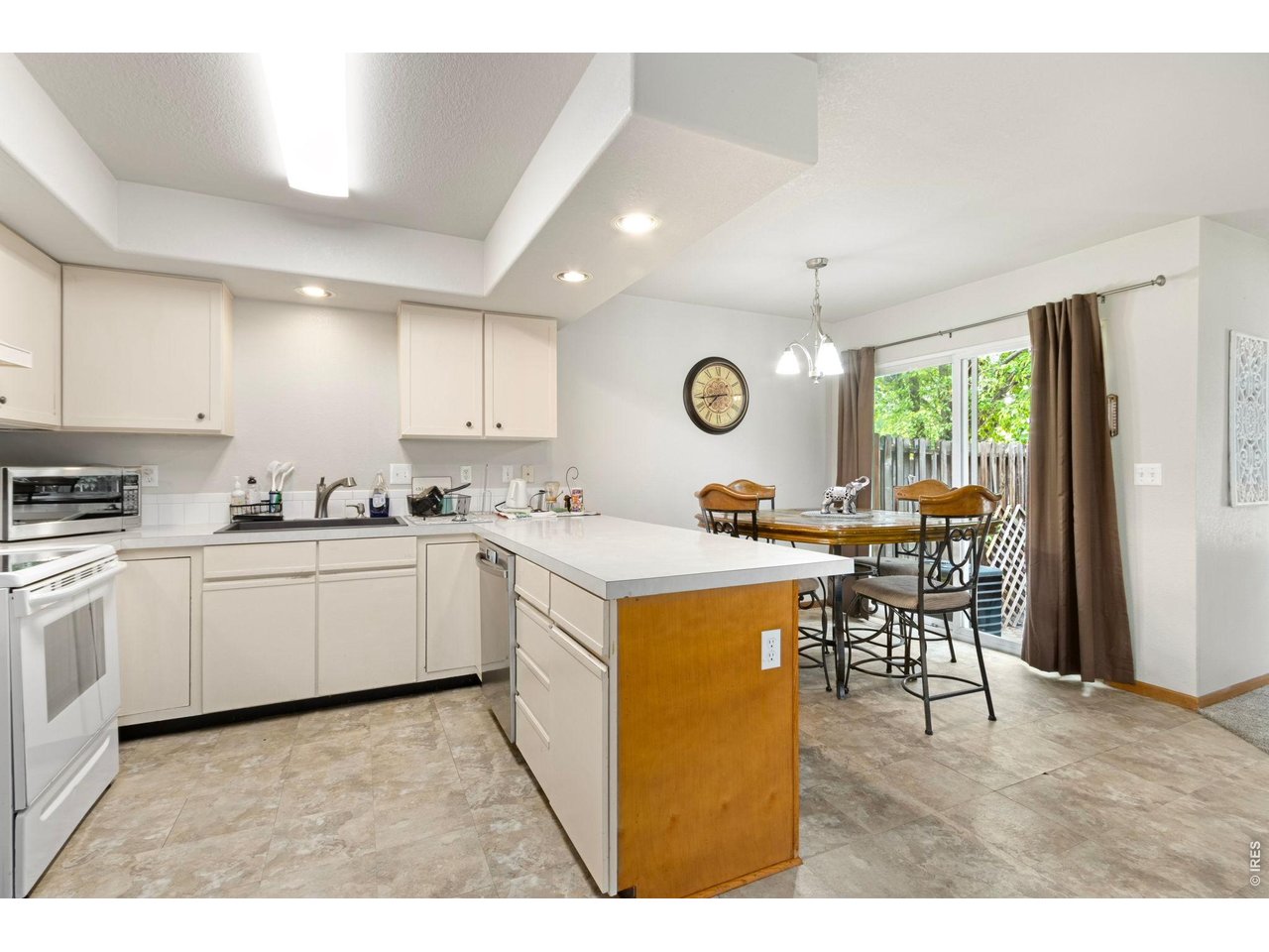 Eat-in kitchen with counter seating and adjacent patio