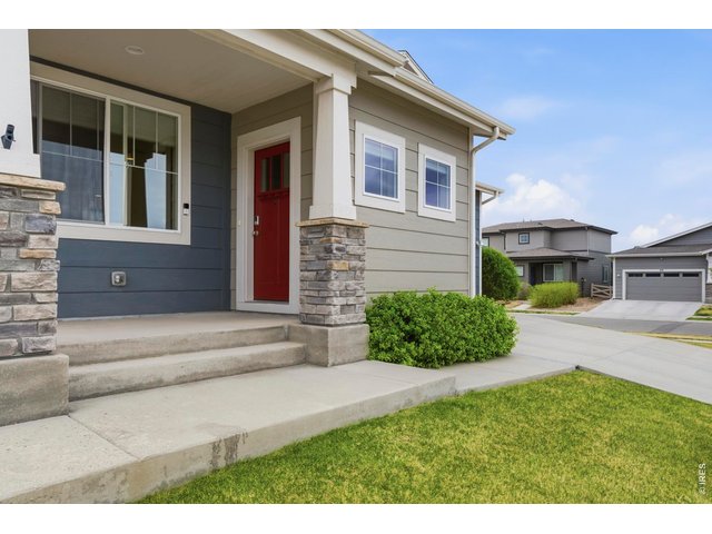 Property Photo 4 Covered front porch is great for engaging with the neighbors.