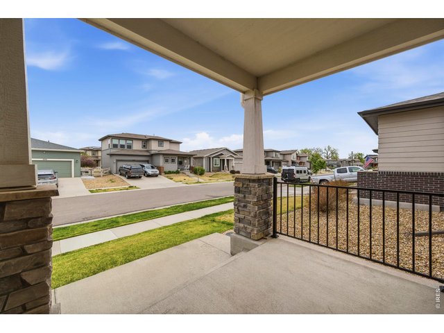 Property Photo 6 Covered front porch is great for engaging with the neighbors.