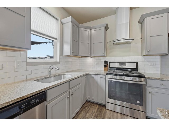 Property Photo 12 Granite countertops and stainless steel appliances give it the modern feel you want.