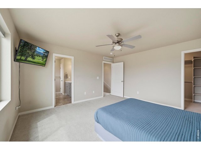 Property Photo 21 Large primary bedroom is a great end-of-the-day retreat.