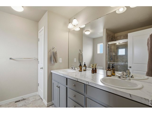 Property Photo 22 Primary bathroom features a double vanity.