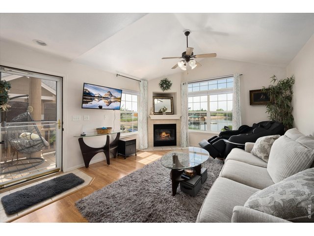 Property Photo 10 Living Room with Vaulted Ceilings & Natural Light Pouring In!