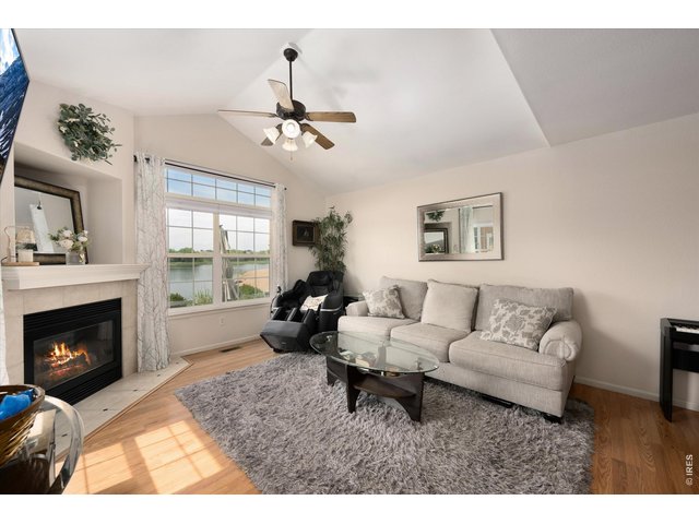 Property Photo 11 Gas Tiled Fireplace, Wood Flooring Throughout Main Level