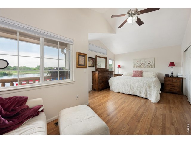 Property Photo 25 Large Primary Retreat with Wood Flooring, Vaulted Ceilings, & Numerous Windows!