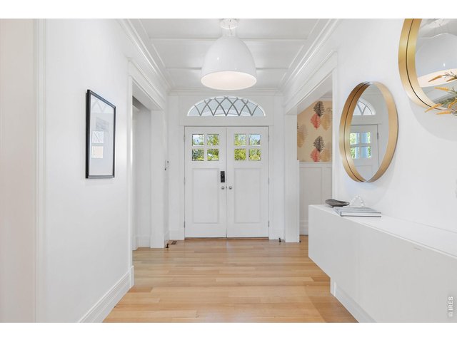 Property Photo 12 A gracious entry introduces interiors defined by wide-plank oak flooring, soaring ceilings, exquisite millwork, and curated designer lighting. 
