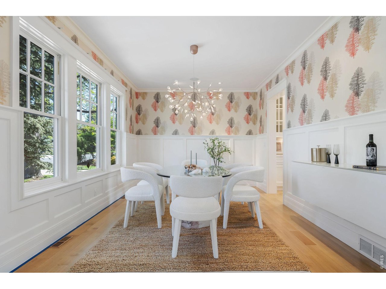 The formal dining room connects to beautifully appointed butler's and storage pantries.
