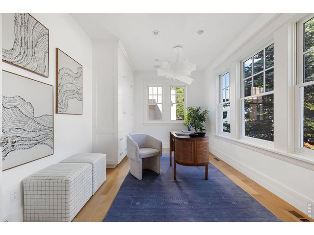 Property Photo 11 A formal office flanks the foyer. Oversized windows and custom storage. 