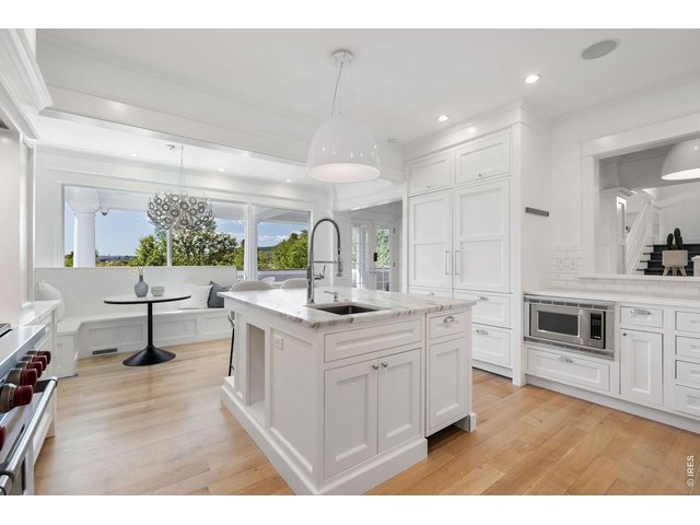 Property Photo 18 Oversized kitchen island and a charming breakfast nook. 