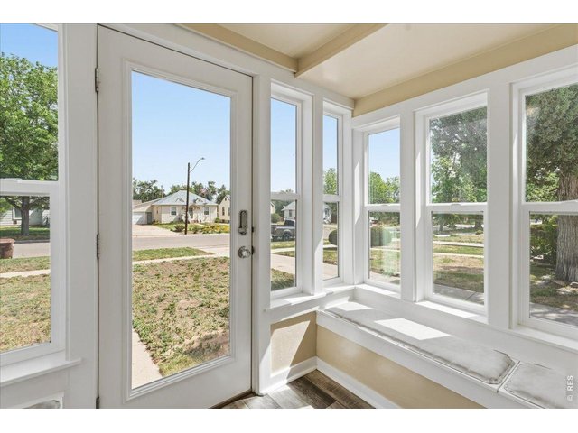 Property Photo 3 Enclosed and updated entryway with new windows and exterior door