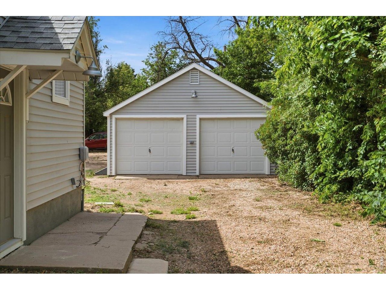 New siding, roof, steel door and electrical service added to detached garage. 