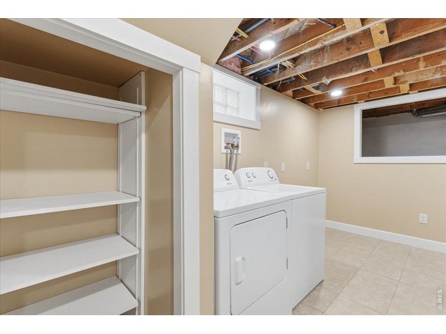 Property Photo 18 Laundry unit and storage space has been tiled and drywalled. 