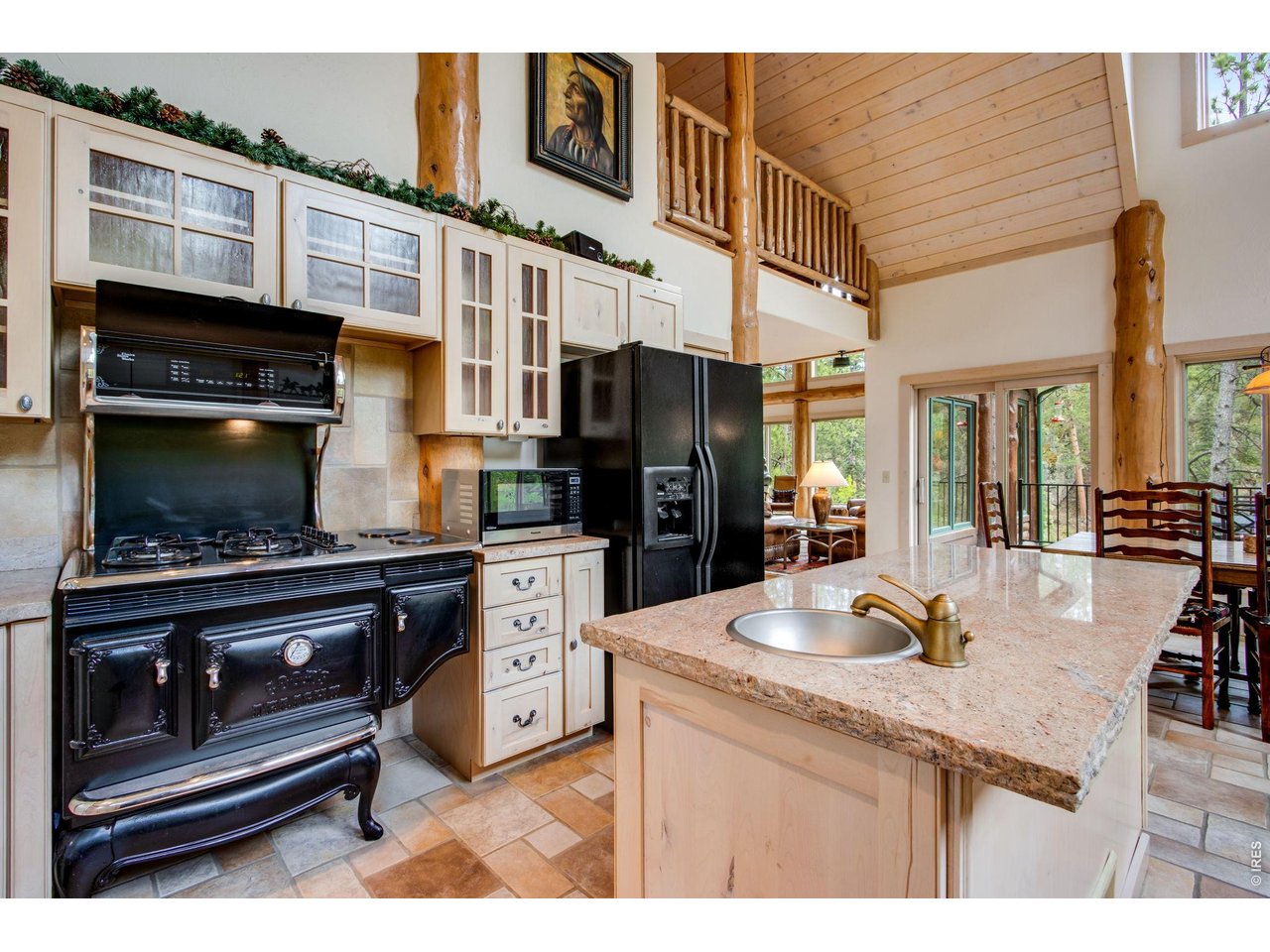 Property Photo 27 The kitchen boasts an Elmira Antique 1867 45" Custom Pro Style gas range