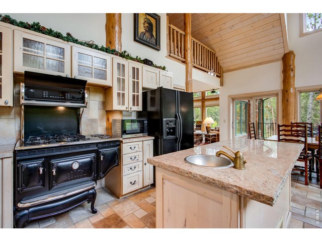 Property Photo 27 The kitchen boasts an Elmira Antique 1867 45" Custom Pro Style gas range