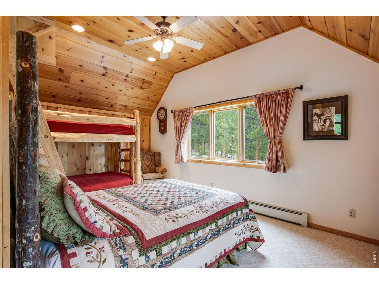 Property Photo 46 Large upstairs bedroom with pine ceilings and wall