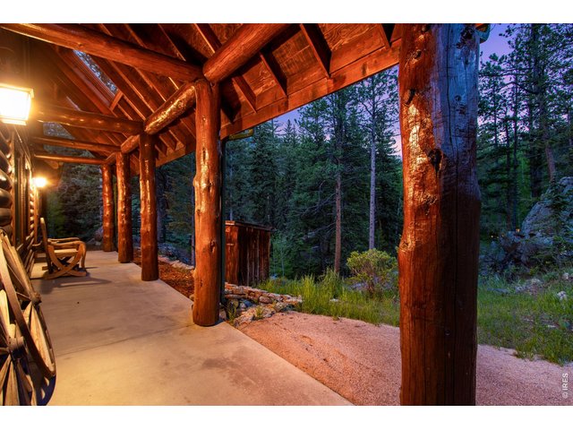 Property Photo 4 Soak in the forest from the covered front patio 