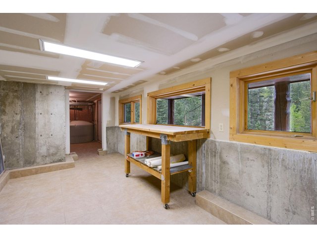 Property Photo 50 Workshop/ storage area with outdoor basement level access