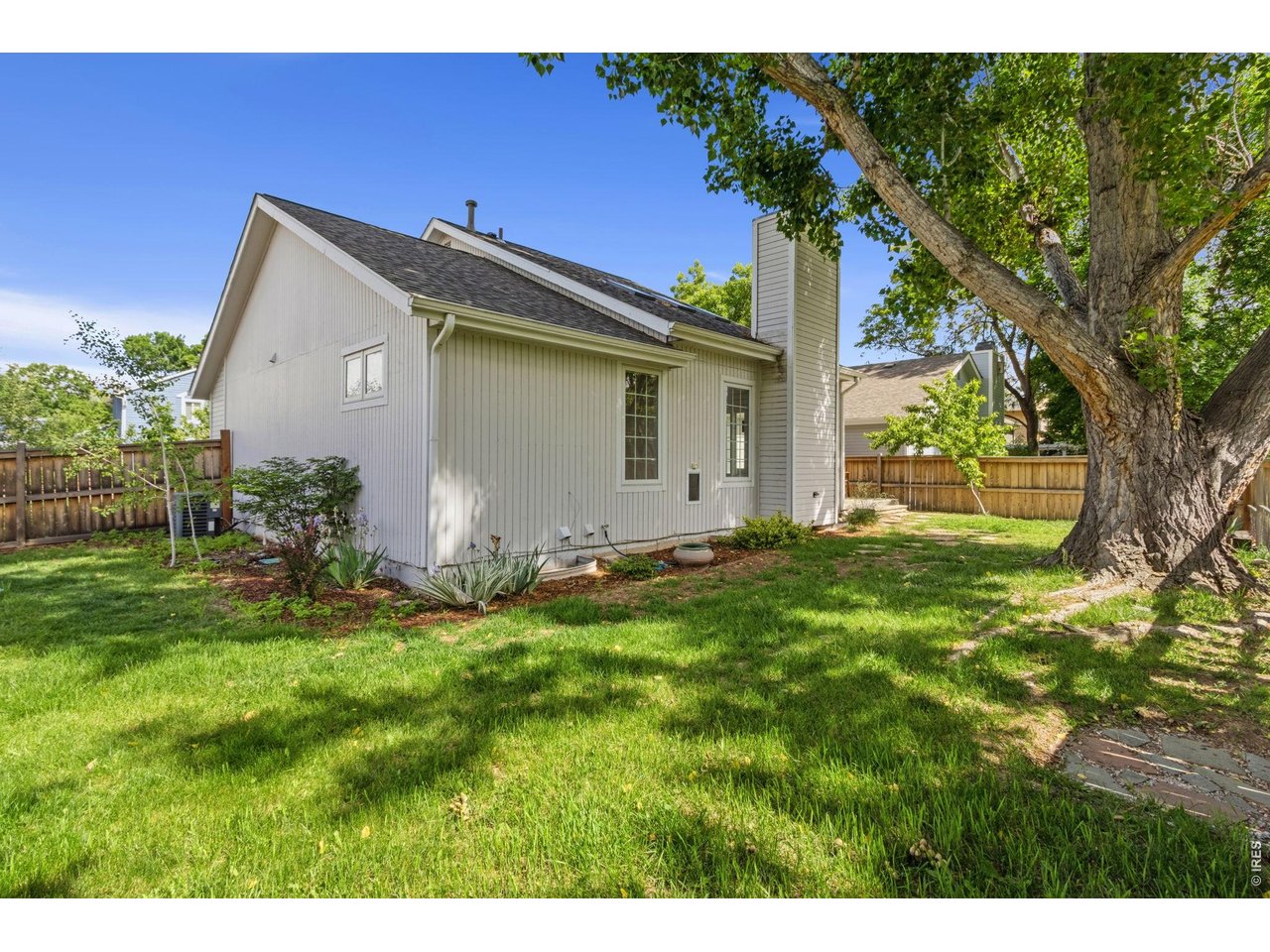 Deck and great landscaping on this fully fenced corner lot backing to open space.