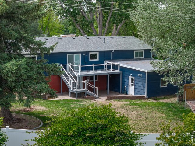 Property Photo 4 Back yard - Upper deck and walk out basement patio