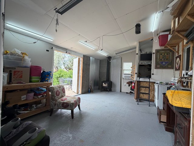 Property Photo 42 Shop area added on to back of attached garage with doors to the back yard.