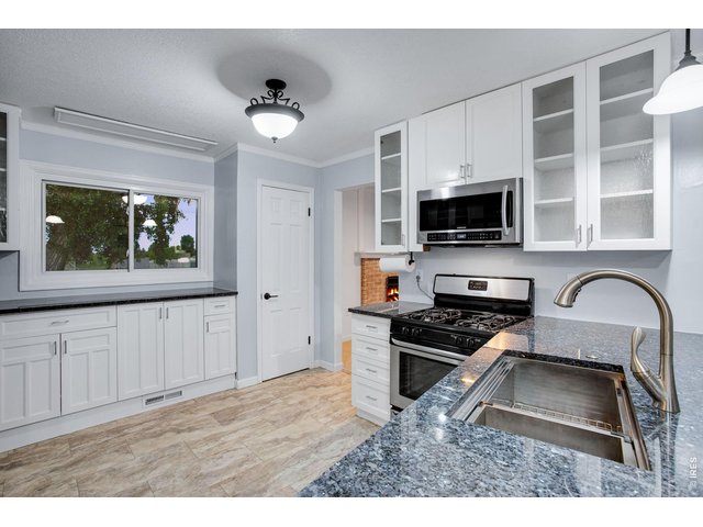Property Photo 13 Cozy Kitchen features a pantry and plenty of cabinets and counter-space 