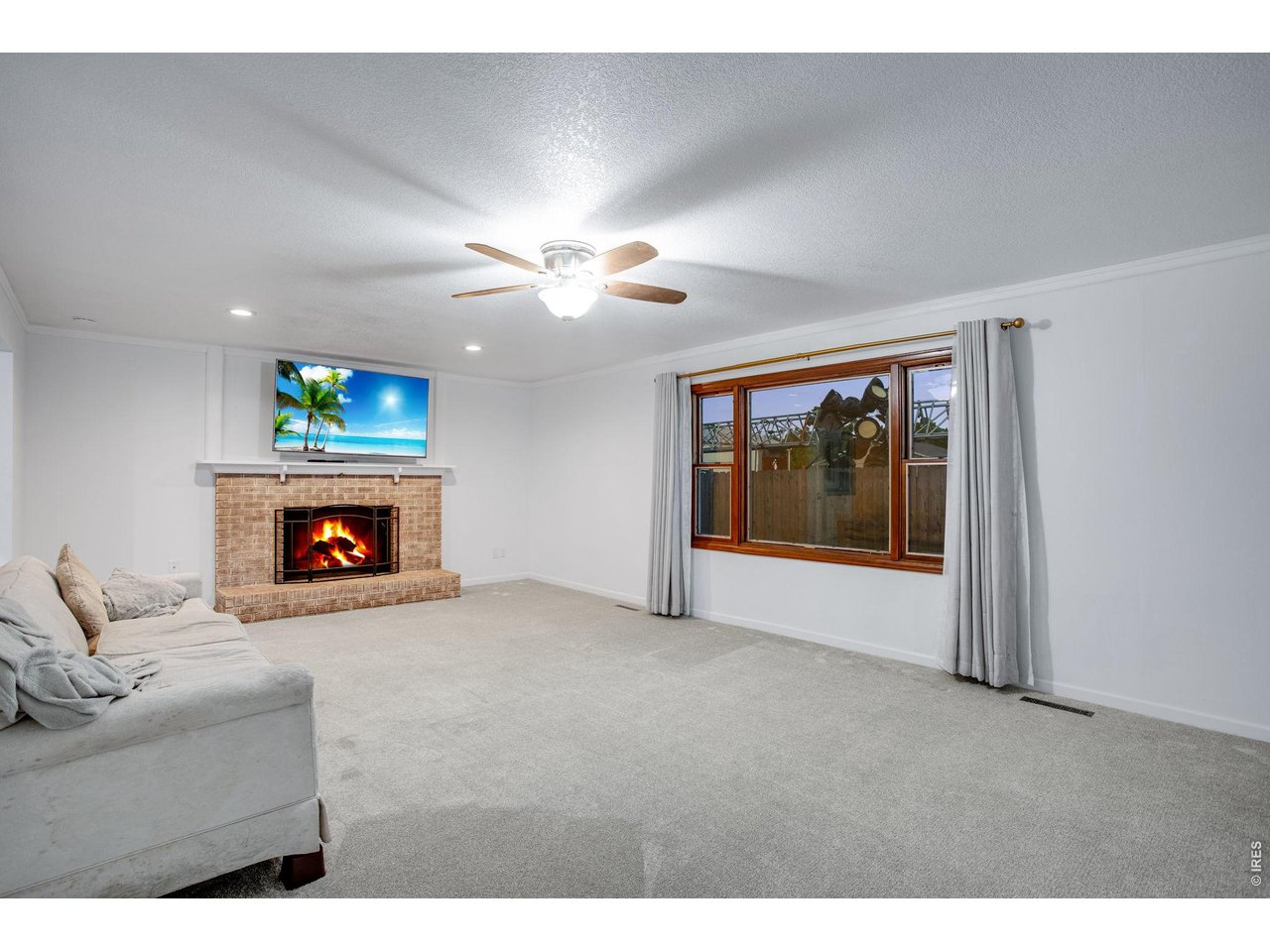 Full length living room with gas fireplace 
