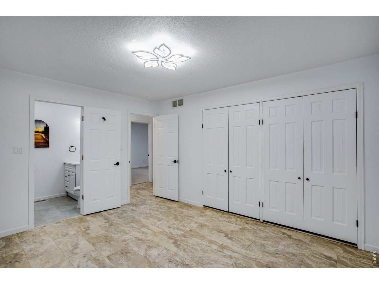 Primary bedroom features 2 closets 
