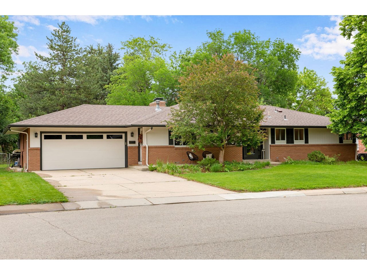 Easy hipped roof line, Bold Mid-Century Brick Streetscape.