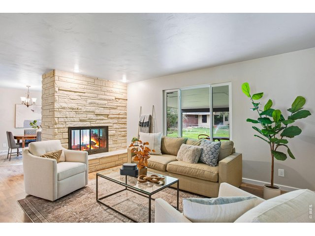 Property Photo 10 An inviting floor to ceiling flagstone wood burning fireplace! 