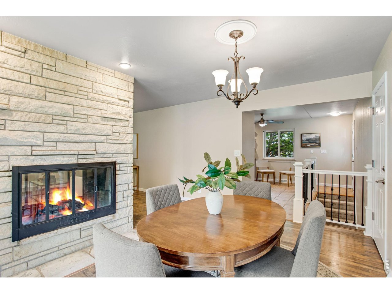 Perfect dining room location, wood laminate floors, full flagstone fireplace! 