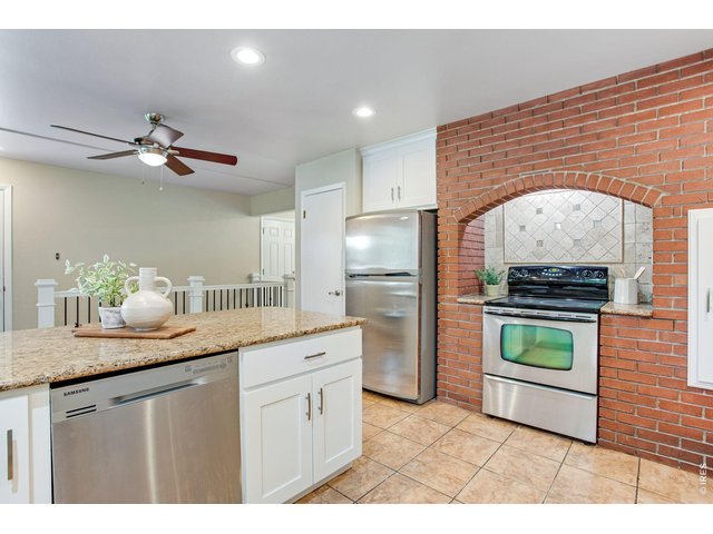 Property Photo 15 Stainless Steel appliances, large brick oven area and vent. 